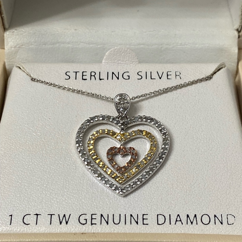 NWT sterling Silver tri color heart necklace.